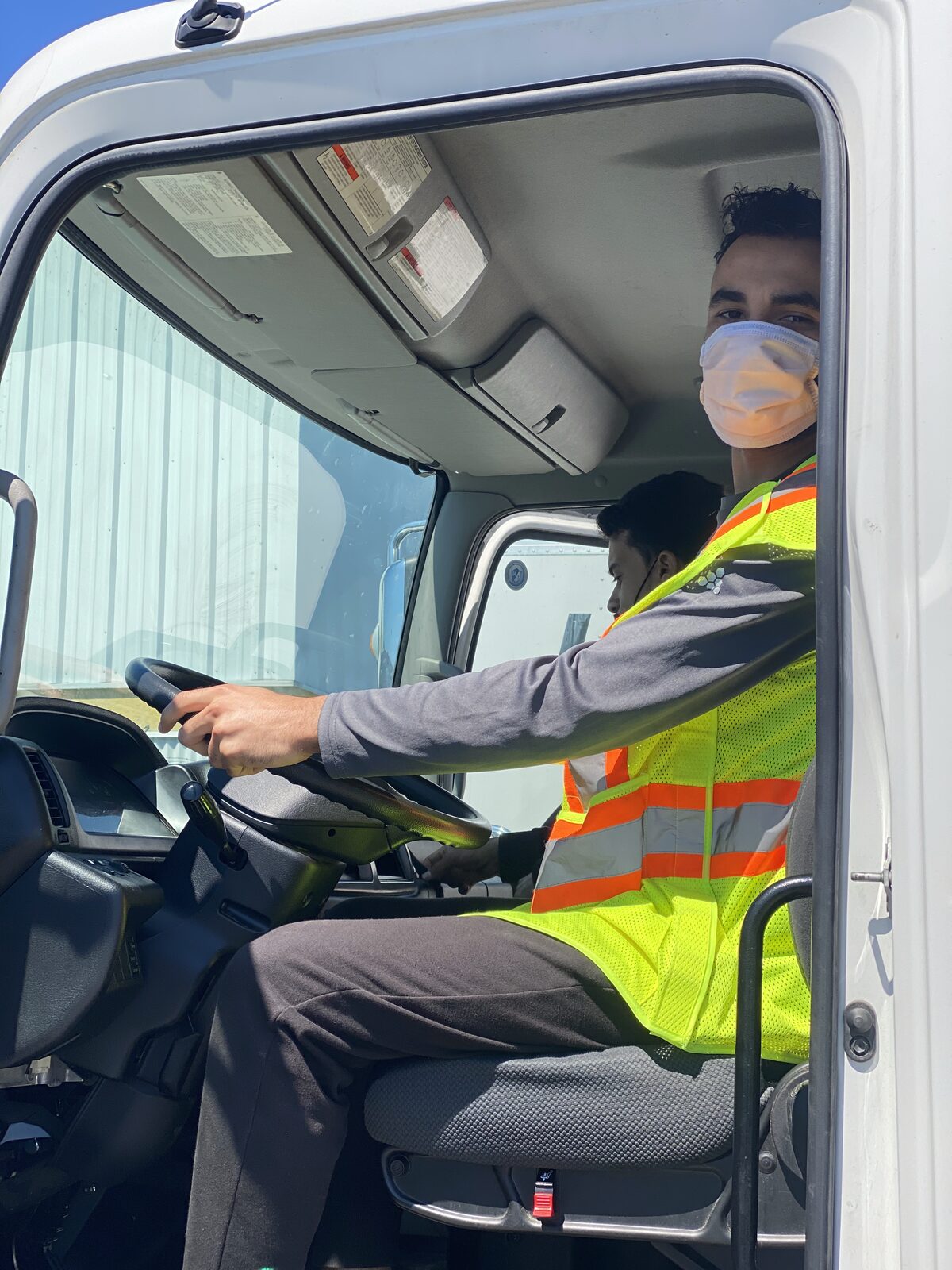 Men In Trucks crew beside the moving truck