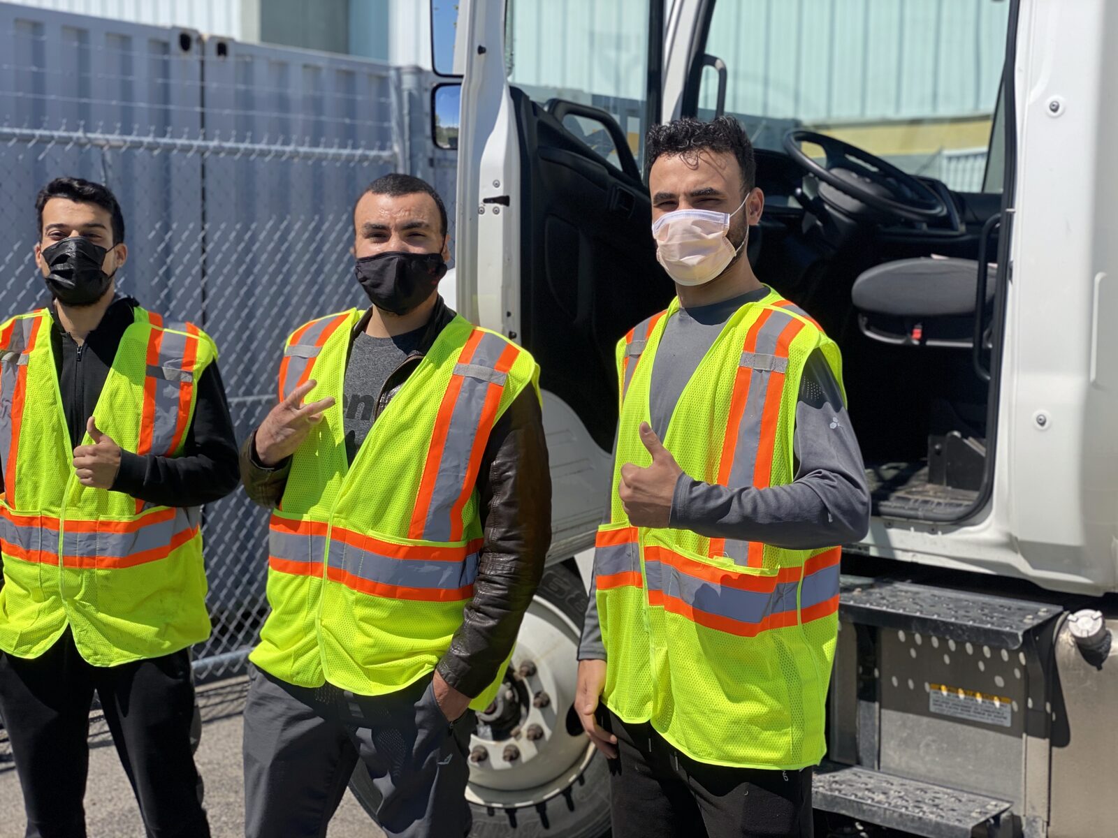 Men In Trucks driver in the cab of a moving truck