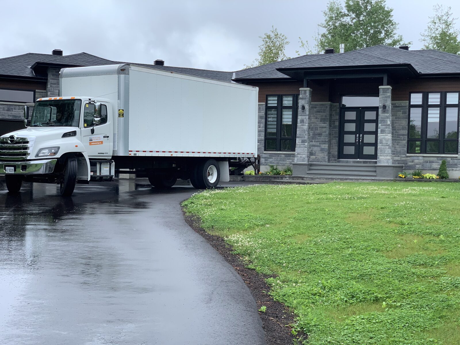 Men In Trucks moving truck at an Ottawa home — moving cost guide