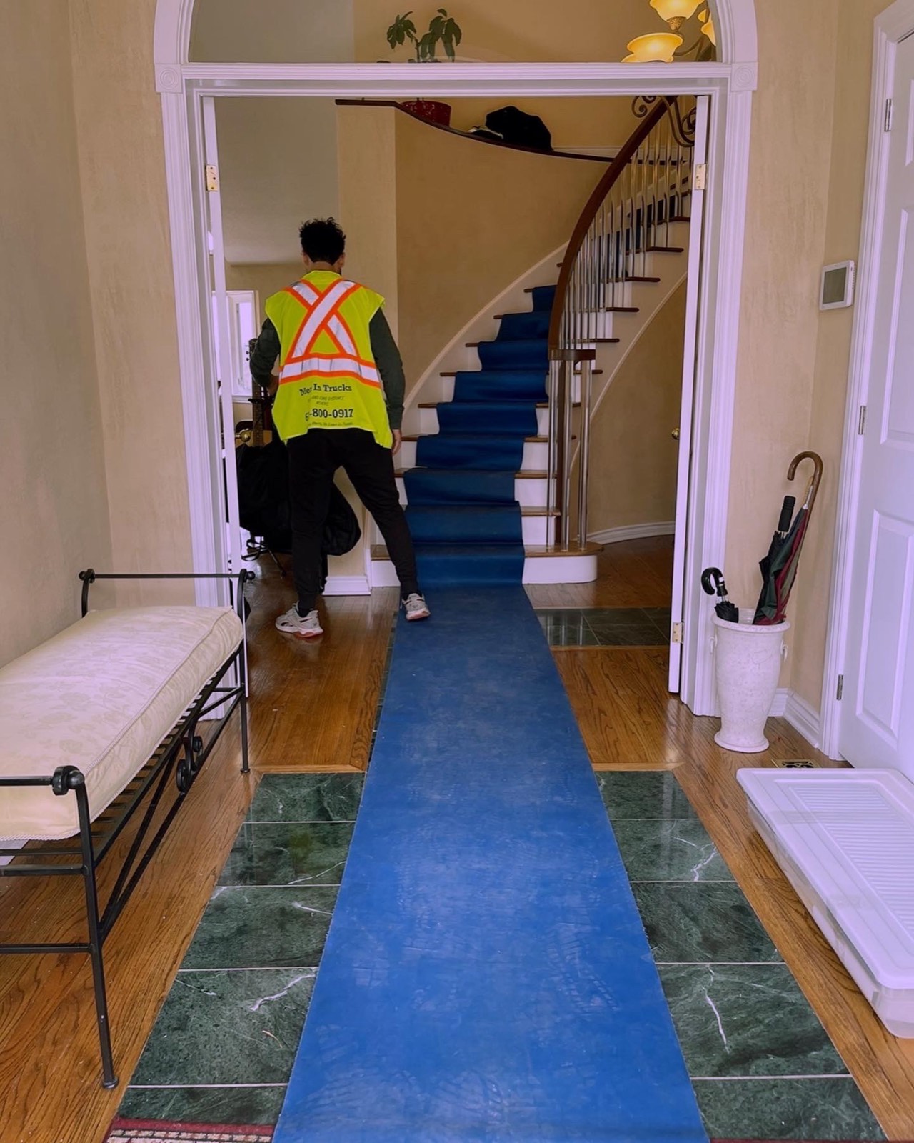 Floor protection runner laid down a hallway before an Ottawa move begins