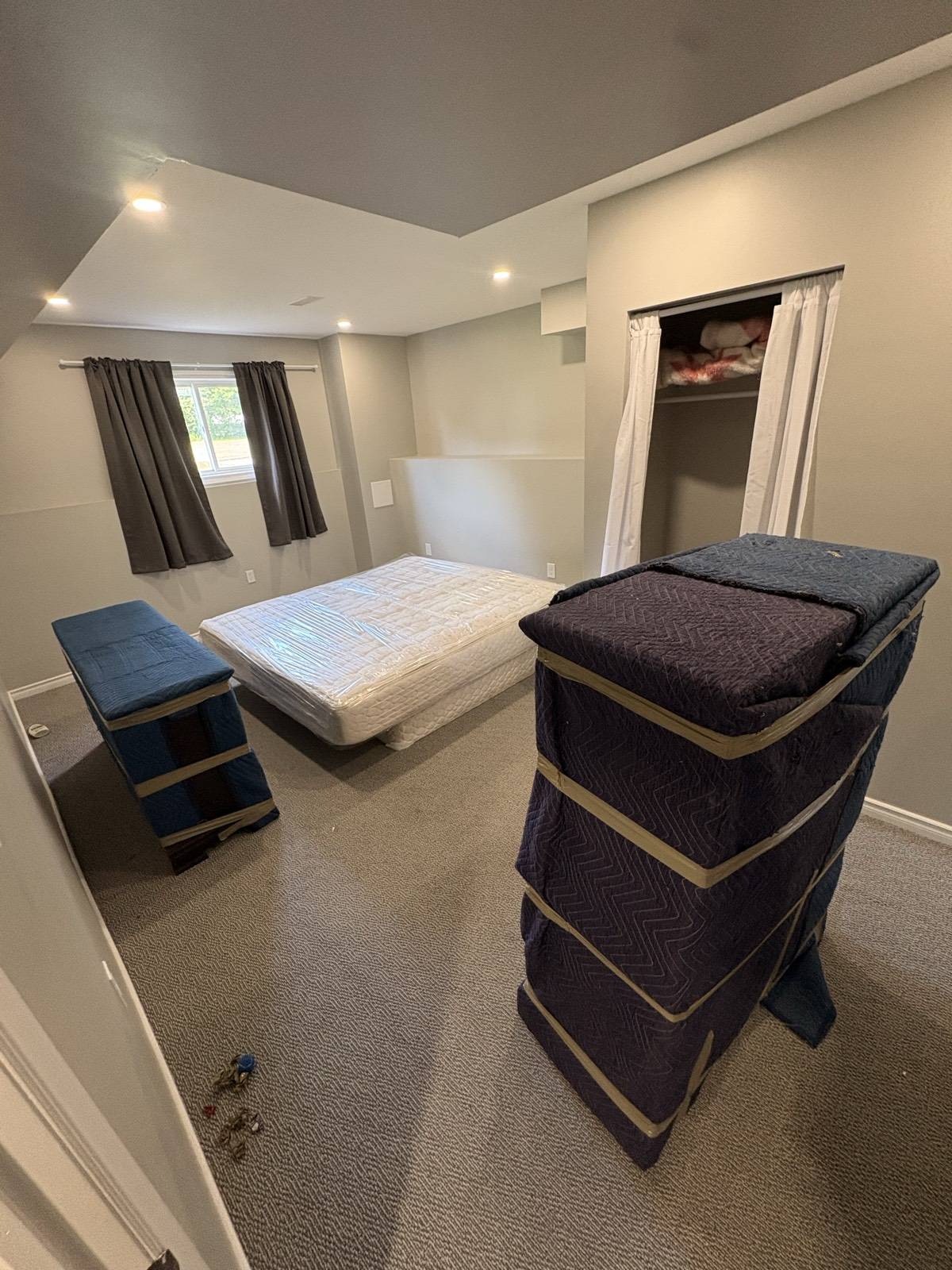 Furniture protected with moving blankets by Men In Trucks during a home move