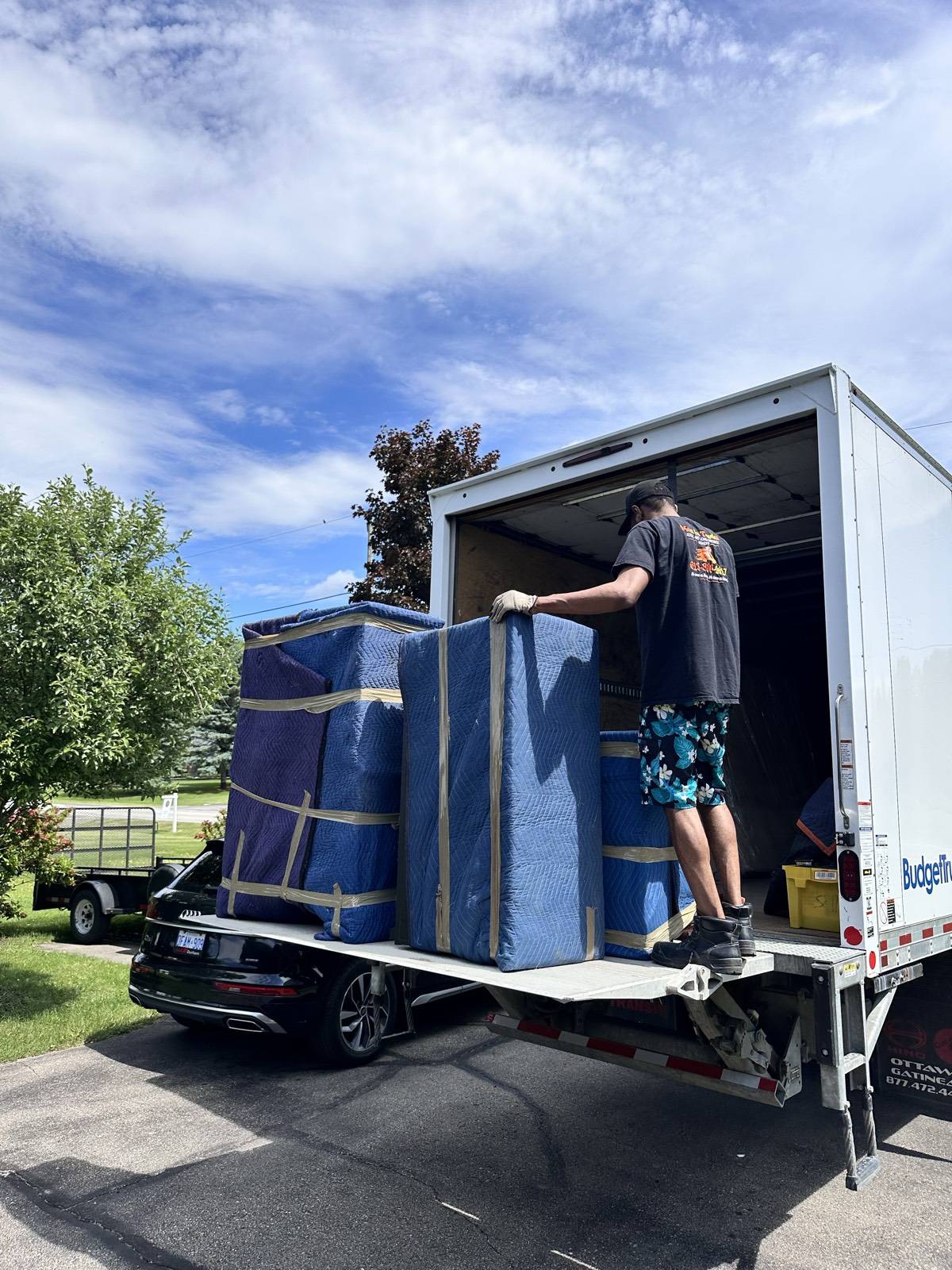 Fully loaded Men In Trucks truck with blanket-wrapped furniture ready for a Cornwall to Ottawa move