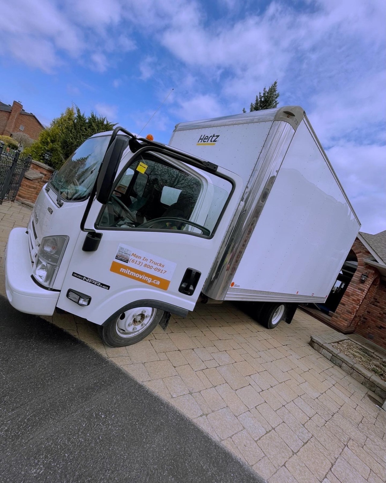 Men In Trucks branded moving truck parked in an Ottawa home driveway