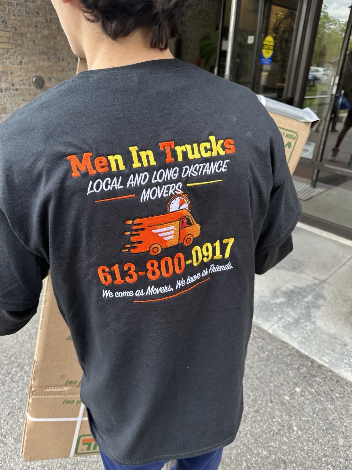 Men In Trucks mover delivering flat-packed moving boxes in Ottawa