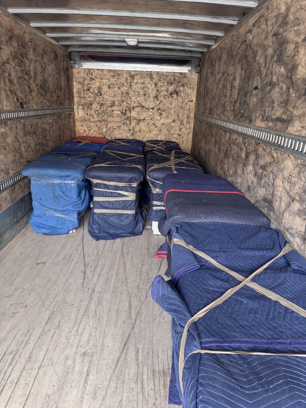 Men In Trucks truck loaded with blanket-wrapped furniture in Ottawa